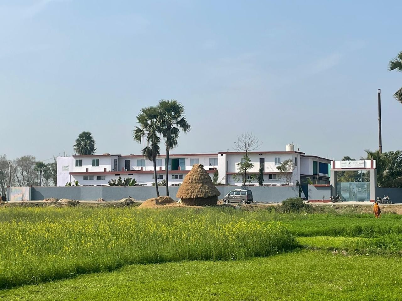 SumArth Kendra main centre beside green agricultural fields in Gaya